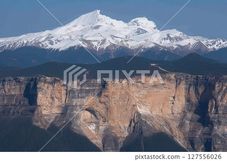 The Balagezong national park in Shangri-la, China, offers a breathtaking landscape view from the top of the mountains, making it a beautiful travel destination with a large river at its base 127556026