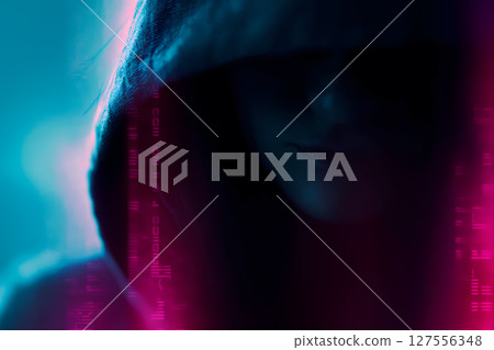 Smirking hoodlum hacker con man in neon lights: bad guy cyberpunk hacking portrait 127556348