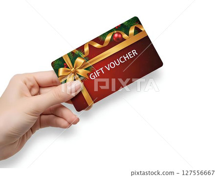 Hand holding achristmas gift voucher card mockup isolated on white background, for e-commerce promotions, retail marketing visuals, or holiday sale graphics 127556667