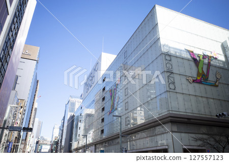 Cityscape shining against the blue sky 127557123