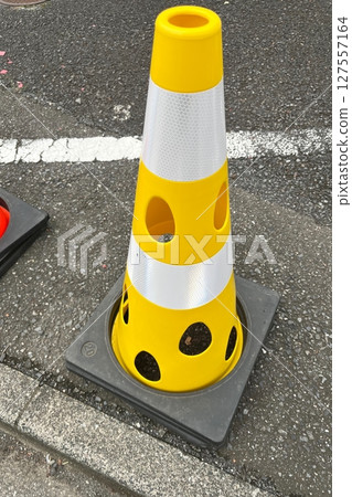 Yellow cone with holes 127557164