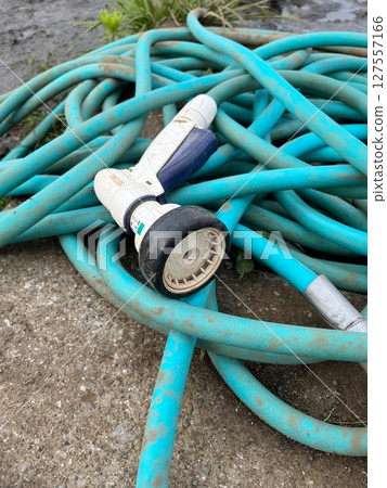 Hose with shower head attached Hose with shower head attached 127557166