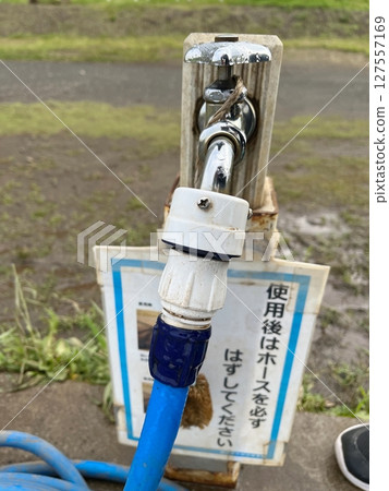 Front view of water supply and joint hose 127557169