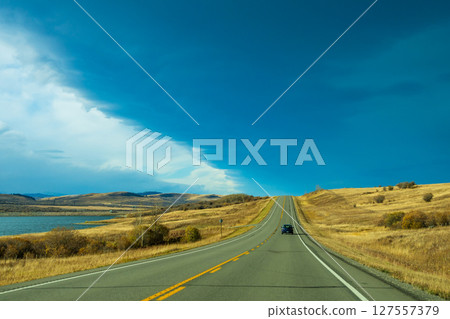 Autumn countryside and a country road called the Cowboy Trail 127557379