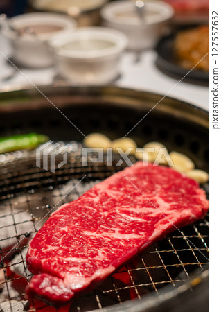 Sirloin Hanwoo Beef, marbled Korean Style Meat on the Grill. BBQ rare meat with soft focus 127557632