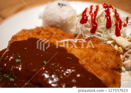 Tonkatsu, Fried Pork Loin Cutlet serve on plate with rice and cabbage Tonkatsu, Fried Pork Loin Cutlet serve on plate with rice and cabbage 127557633