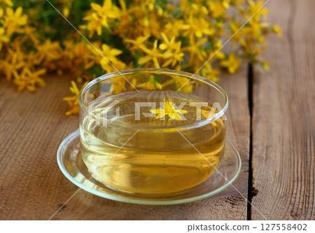 Herbal tea from Hypericum perforatum commonly known as St John's wort. Herbal tea from Hypericum perforatum commonly known as St John's wort. 127558402