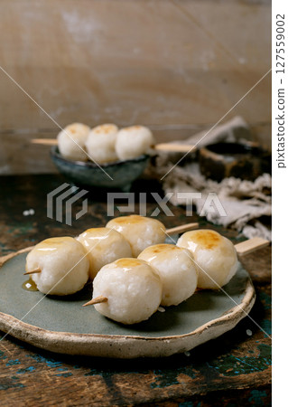 Japanese Dango Dumplings on Wooden Plate 127559002