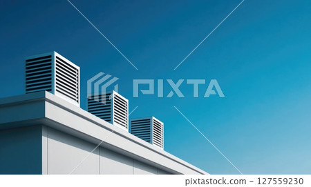 Modern Rooftop Ventilation Units Against Blue Sky Modern Rooftop Ventilation Units Against Blue Sky 127559230