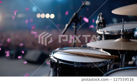 Drum Kit on Stage with Concert Crowd and Confetti 127559516