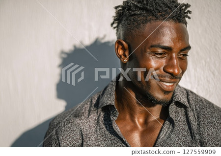 Man Smiling in Patterned Shirt 127559909