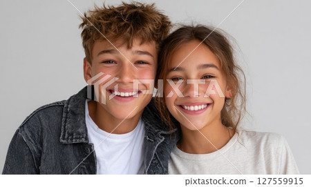 Happy Teen Siblings Smiling Together Happy Teen Siblings Smiling Together 127559915