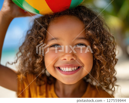 Laughing Girl with Ball on the Beach Laughing Girl with Ball on the Beach 127559944