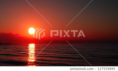 Glowing Sunset Reflecting Over Tranquil Ocean Horizon Glowing Sunset Reflecting Over Tranquil Ocean Horizon 127559995