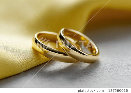 Golden Wedding Rings on Elegant Fabric 127560016