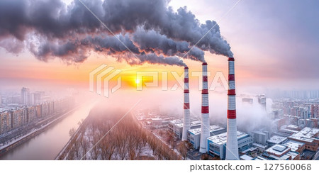 Urban Pollution from Industrial Chimneys at Sunrise 127560068