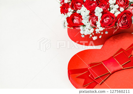 Bouquet of red roses in gift box in form of heart, selective focus, free space to copy text Bouquet of red roses in gift box in form of heart, selective focus, free space to copy text 127560211