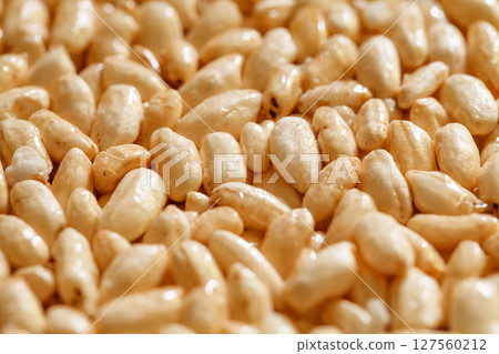 Air rice oval in dry sweet syrup, treat, close-up, side view, selective focus Air rice oval in dry sweet syrup, treat, close-up, side view, selective focus 127560212