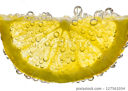 Lemon sliced semicircle in water with air bubbles, in background light, close-up isolated, white, background, clipping, path Lemon sliced semicircle in water with air bubbles, in background light, close-up isolated, white, background, clipping, path 127561034