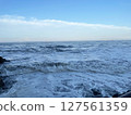 Sea waves rocky beach 127561359