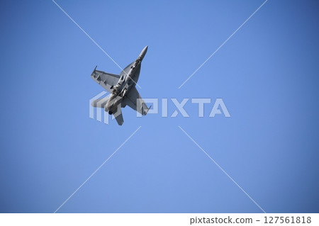 Hornet fighter jet performing acrobatic flying Hornet fighter jet performing acrobatic flying 127561818
