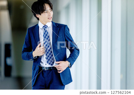 Young businessman in a suit Young businessman in a suit 127562104