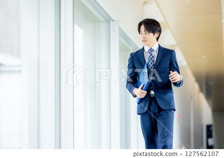 Young businessman in a suit Young businessman in a suit 127562107