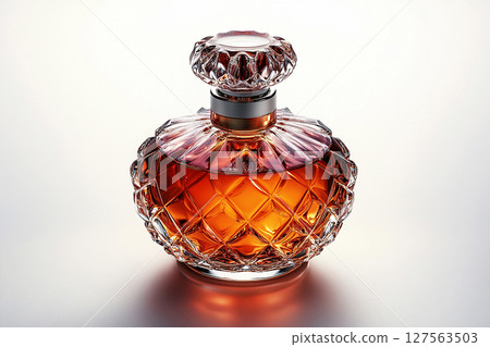 Perfume bottle with glossy on its glass surface, conveying elegance and sophistication. Ideal for high-end perfume advertisements. 127563503