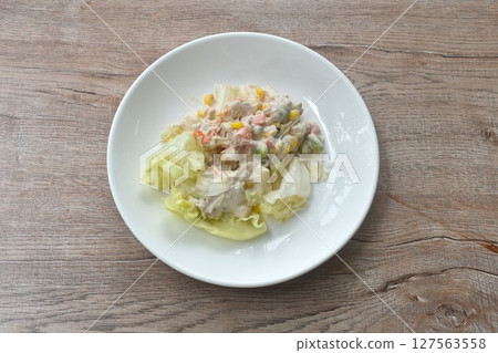 mashed tuna with corn and garden pea couple cabbage vegetable salad dressing cream sauce on plate mashed tuna with corn and garden pea couple cabbage vegetable salad dressing cream sauce on plate 127563558
