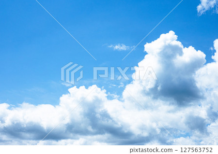 A simple landscape of blue sky and white clouds A simple landscape of blue sky and white clouds 127563752