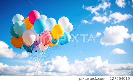 Balloons dancing in the sky 127564019