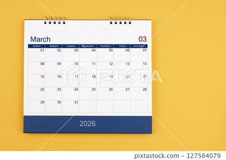 March 2026 desk calendar on the yellow table, planning for business meeting or planning concept. March 2026 desk calendar on the yellow table, planning for business meeting or planning concept. 127564079