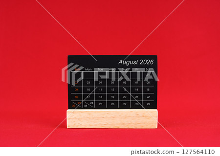 August 2026 chalkboard calendar on red color background. 127564110