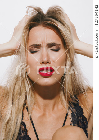 emotions and feelings concept - beautiful blonde in delicate lingerie, moaning in deep pleasure, trembling as she surrenders to passion, eyes closed, fully immersed in orgasmic delight emotions and feelings concept - beautiful blonde in delicate lingerie, moaning in deep pleasure, trembling as she surrenders to passion, eyes closed, fully immersed in orgasmic delight 127564142
