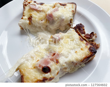 Croque Monsieur: A French baked sandwich with rich cheese. Croque Monsieur: A French baked sandwich with rich cheese. 127564602