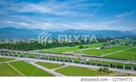 The Hokuriku Shinkansen viaduct in the Shimoyama area of Nyuzen Town, Toyama Prefecture, during the rainy season The Hokuriku Shinkansen viaduct in the Shimoyama area of Nyuzen Town, Toyama Prefecture, during the rainy season 127564771