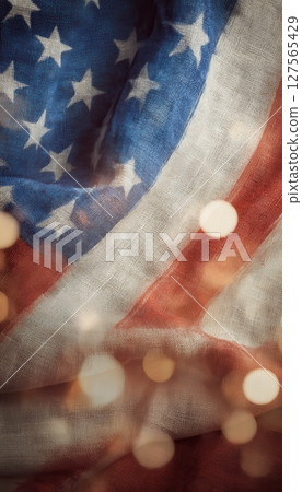 American flag with festive bokeh lights celebrating Independence Day and patriotic national pride 127565429