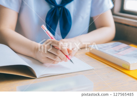 Hands of a high school girl in class Hands of a high school girl in class 127565485