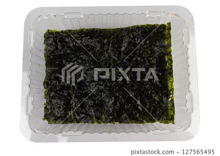 Clear plastic box with seaweed on white background Clear plastic box with seaweed on white background 127565495