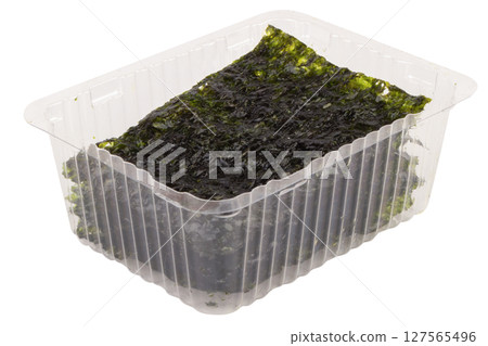 Clear plastic box with seaweed on white background Clear plastic box with seaweed on white background 127565496