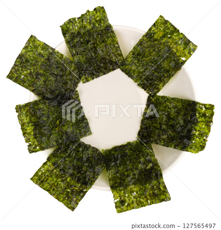 Seaweed sheets on a white background plate Seaweed sheets on a white background plate 127565497