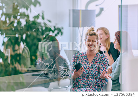 Business Team of Women Discussing New Topics and Strategies to Improve Client Operations. Business Team of Women Discussing New Topics and Strategies to Improve Client Operations. 127566384