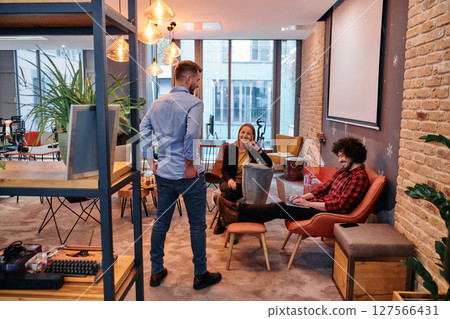 Office Colleagues Enjoying Break Time Together. 127566431