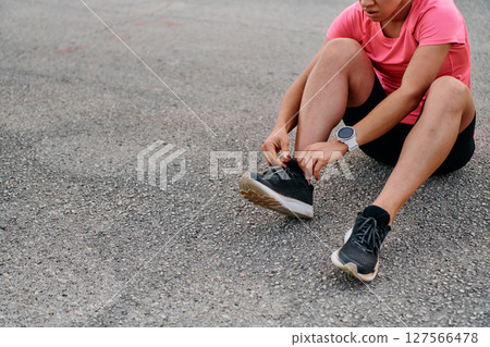 Athletic Woman Preparing for Morning Run Athletic Woman Preparing for Morning Run 127566478