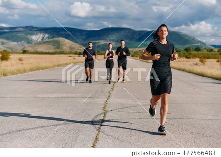 Leader Guiding Athletes on a Sunny Day Run 127566481
