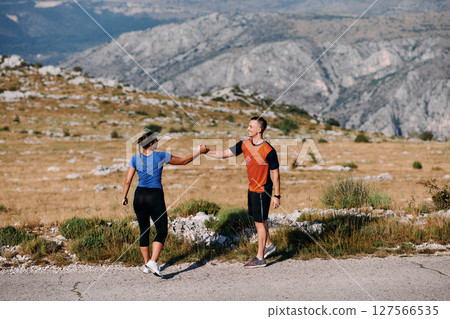 Joyful Couple Celebrating the Successful Completion of a Morning Run. 127566535