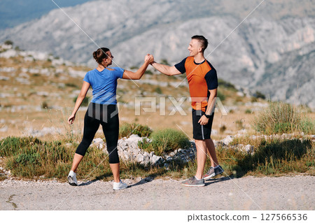 Joyful Couple Celebrating the Successful Completion of a Morning Run. 127566536