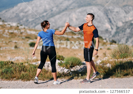 Joyful Couple Celebrating the Successful Completion of a Morning Run. 127566537