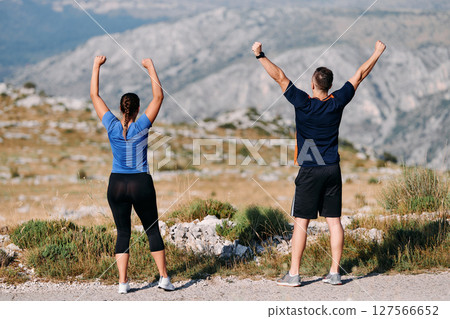Joyful Couple Celebrating the Successful Completion of a Morning Run. 127566652