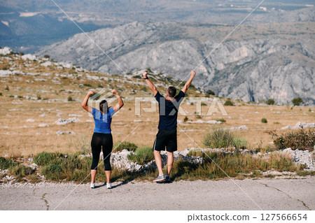 Joyful Couple Celebrating the Successful Completion of a Morning Run. 127566654